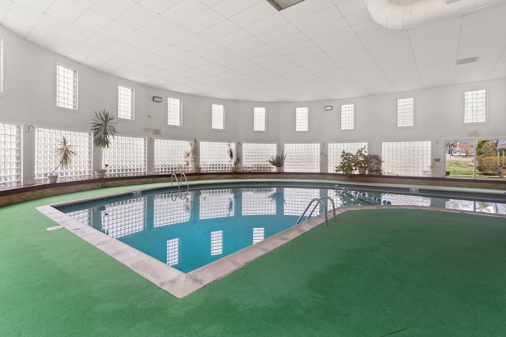 14 Shadowbrook Lane, Unit 30 Milford, MA 01757 - Photo 18 of 18 a view of a living room and kitchen