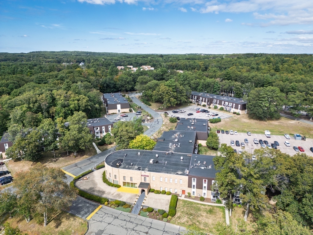 14 Shadowbrook Lane, Unit 30 Milford, MA 01757 - Photo 2 of 18 a view of a swimming pool with a yard
