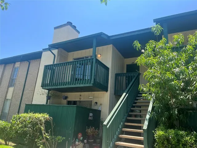 a view of balcony with wooden stairs