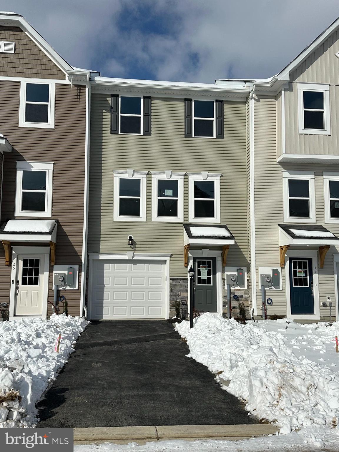 a front view of a house with many windows