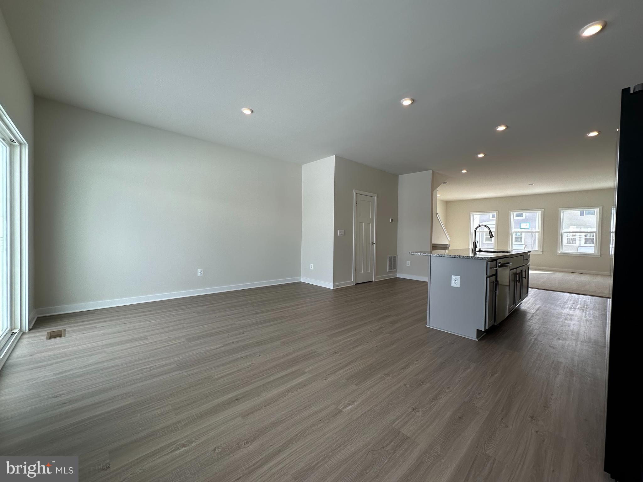 69 Trotting Road Inwood, WV 25428 - Photo 13 of 43 an empty room with wooden floor and windows