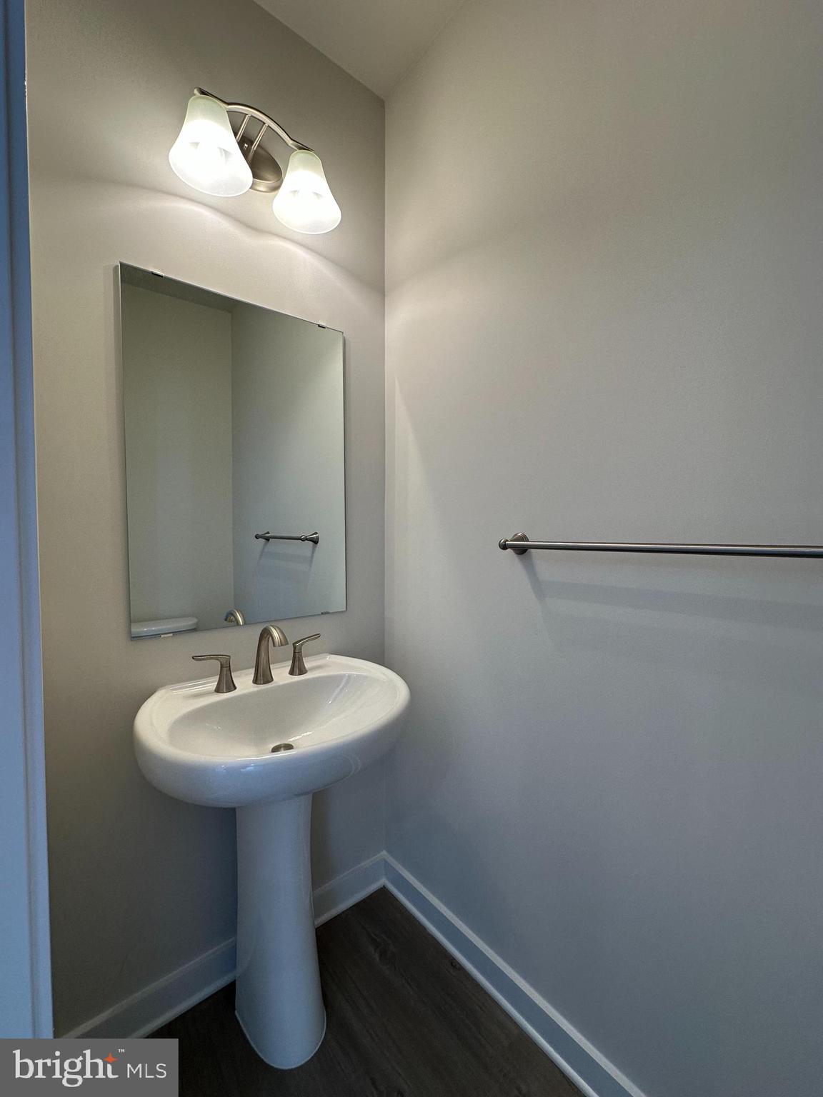 69 Trotting Road Inwood, WV 25428 - Photo 17 of 43 a bathroom with a sink a mirror and a toilet