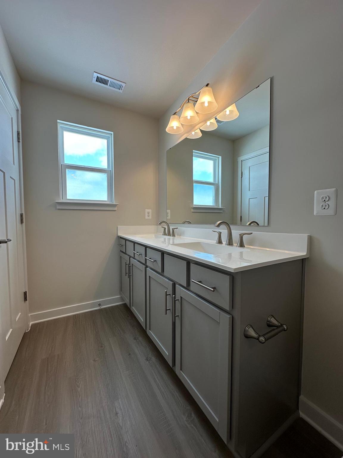 69 Trotting Road Inwood, WV 25428 - Photo 24 of 43 a bathroom with a double vanity sink and a mirror