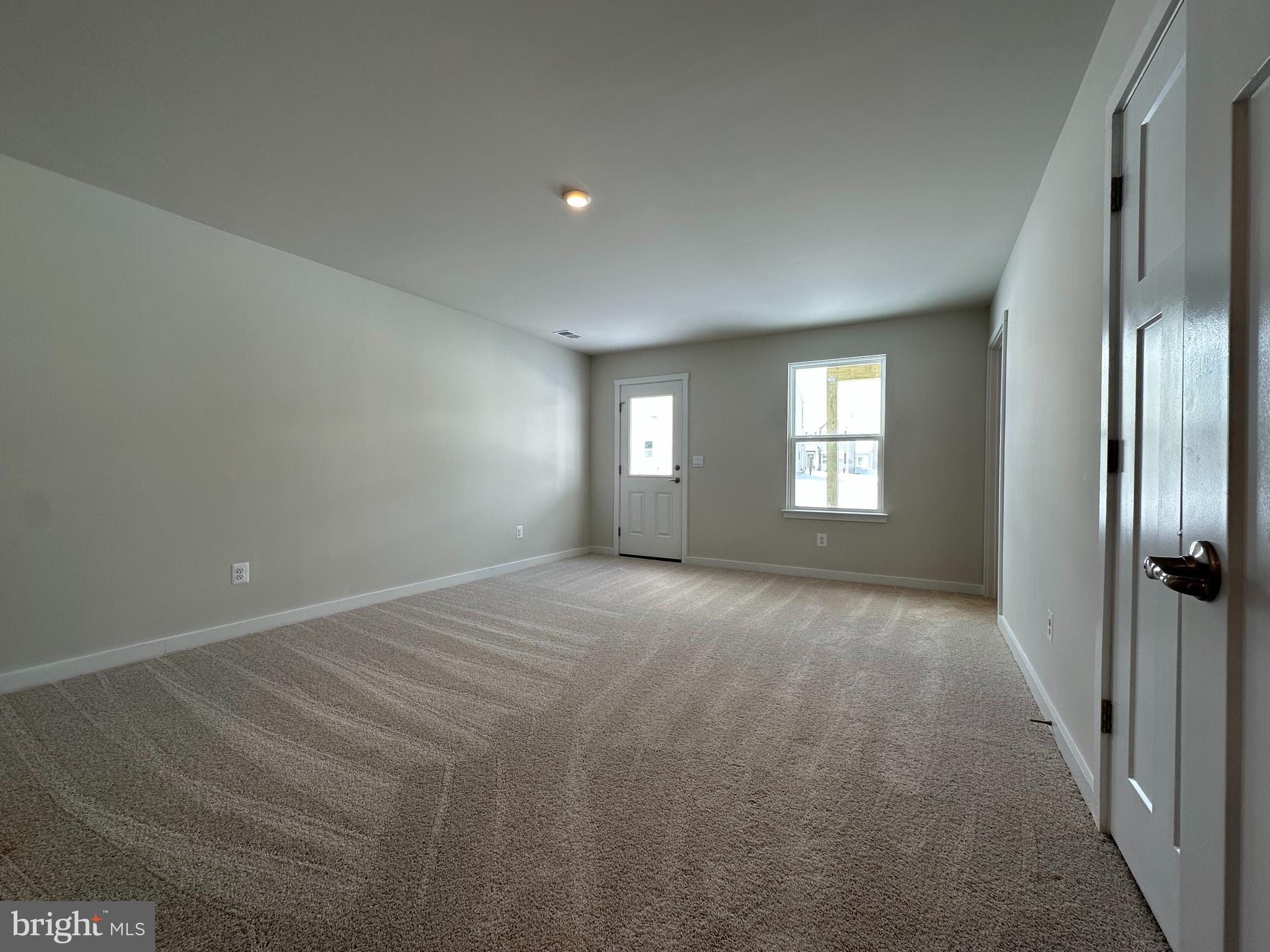 69 Trotting Road Inwood, WV 25428 - Photo 6 of 43 a view of empty room with windows
