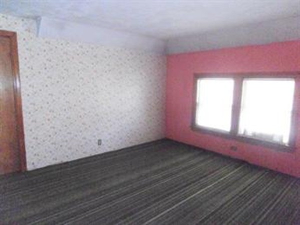 53 Calumet Road Holyoke, MA 01040 - Photo 11 of 12 a view of empty room with wooden floor and fan