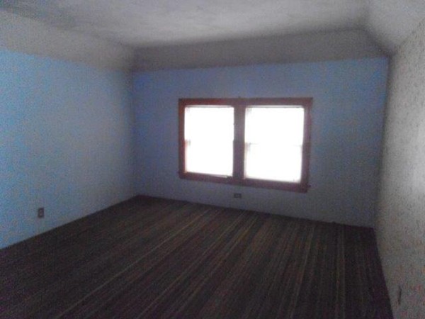 53 Calumet Road Holyoke, MA 01040 - Photo 12 of 12 an empty room with wooden floor and windows