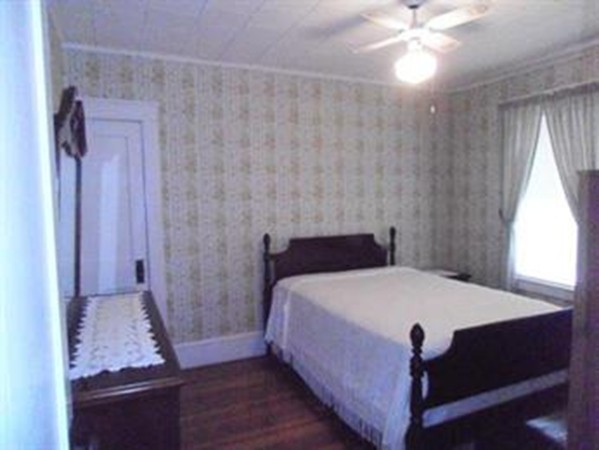 53 Calumet Road Holyoke, MA 01040 - Photo 3 of 12 a bedroom with a bed and a mirror