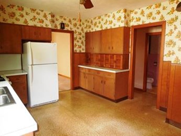 53 Calumet Road Holyoke, MA 01040 - Photo 7 of 12 a view of a refrigerator in kitchen and an empty room