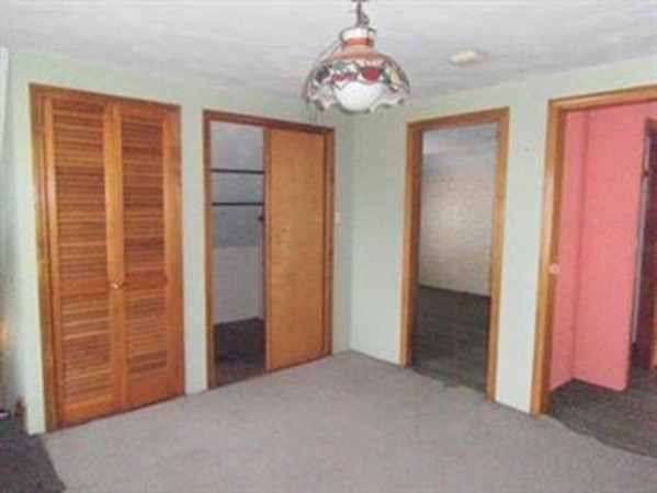 53 Calumet Road Holyoke, MA 01040 - Photo 10 of 12 an empty room with windows and closet