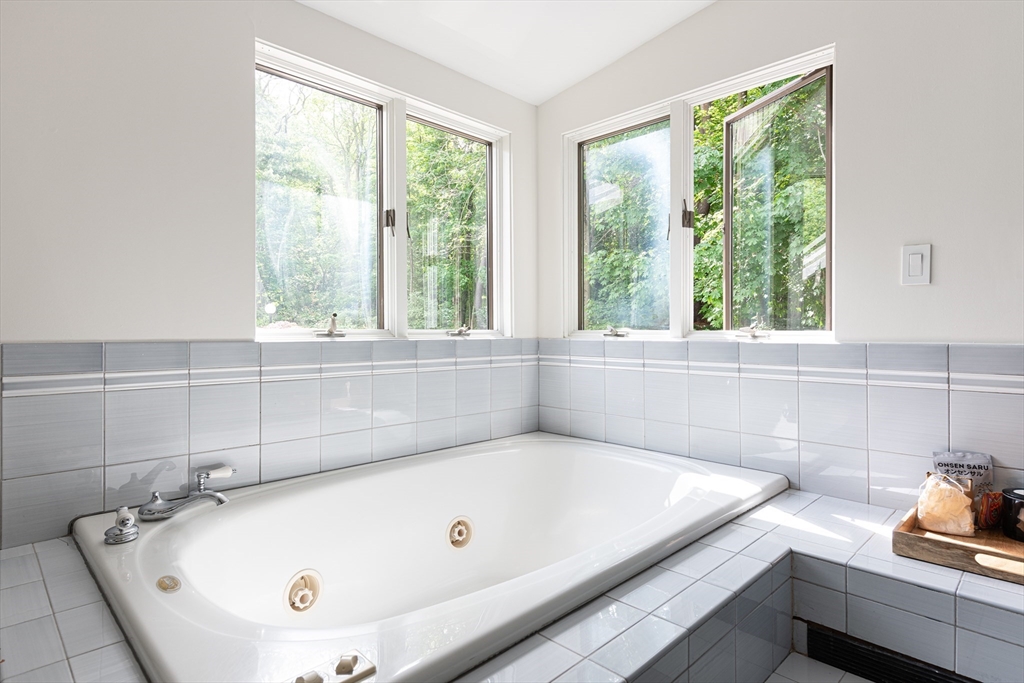 7 Diamond Road Lexington, MA 02420 - Photo 25 of 42 a bath tub sitting in a bathroom next to a window