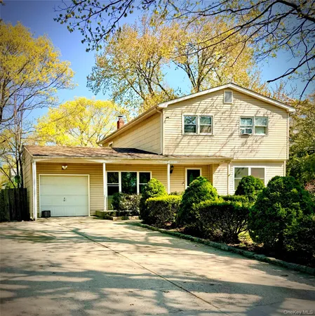 a house view with a garden space