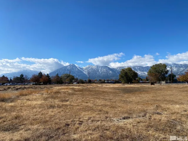 a view of an ocean beach and mountain