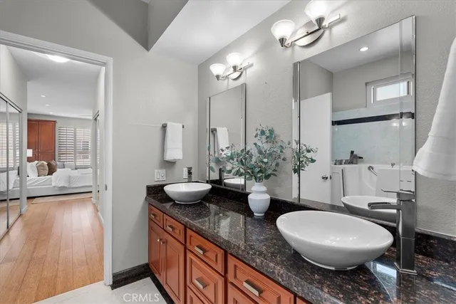 a bathroom with a shower and a sink