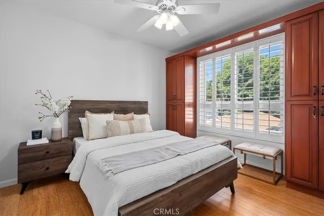 a bedroom with a large bed and a window