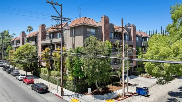 a view of a chairs and table in the backyard