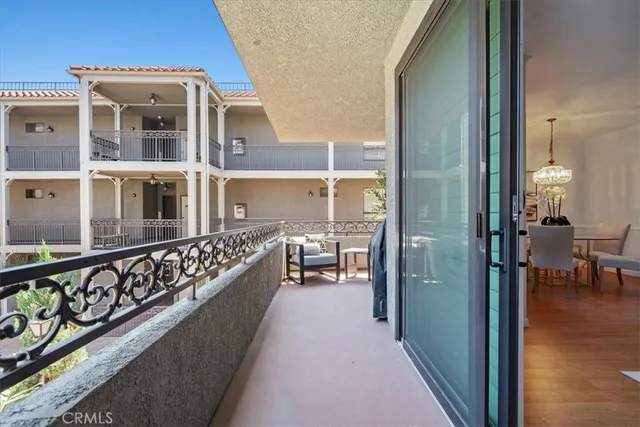 a view of a balcony with chairs