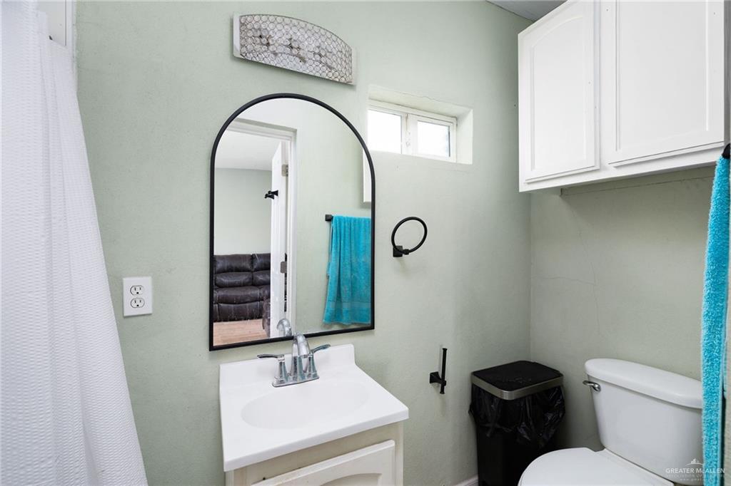 0 Out Of Area Roma, TX 78584 - Photo 12 of 23 a bathroom with a toilet sink and mirror