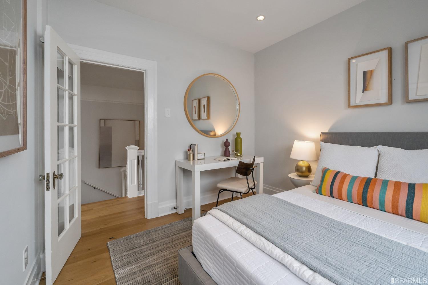 104 3rd Avenue San Francisco, CA 94118 - Photo 16 of 41 a bedroom with a bed and a table in it