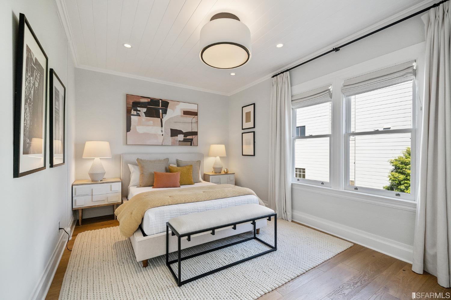 104 3rd Avenue San Francisco, CA 94118 - Photo 18 of 41 a bedroom with a bed and window