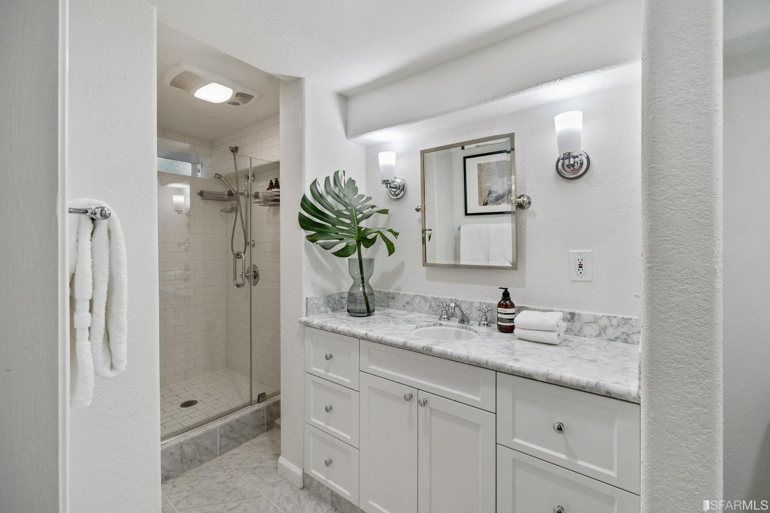104 3rd Avenue San Francisco, CA 94118 - Photo 35 of 41 a bathroom with a granite countertop sink mirror and shower