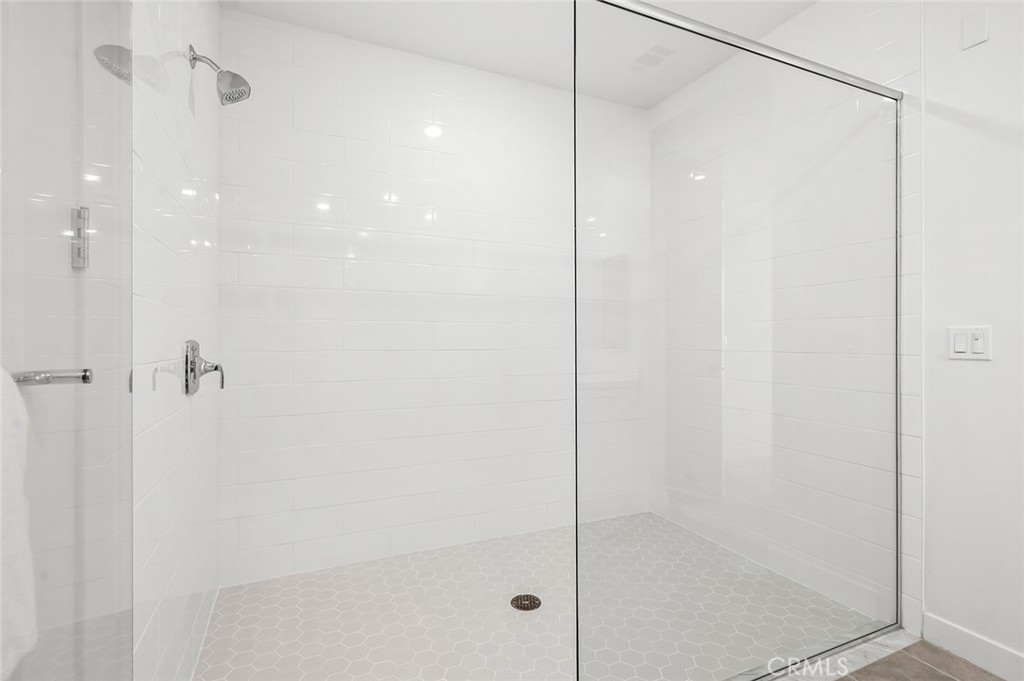 3604 Rivington Irvine, CA 92612 - Photo 22 of 54 a bathroom with a glass shower door