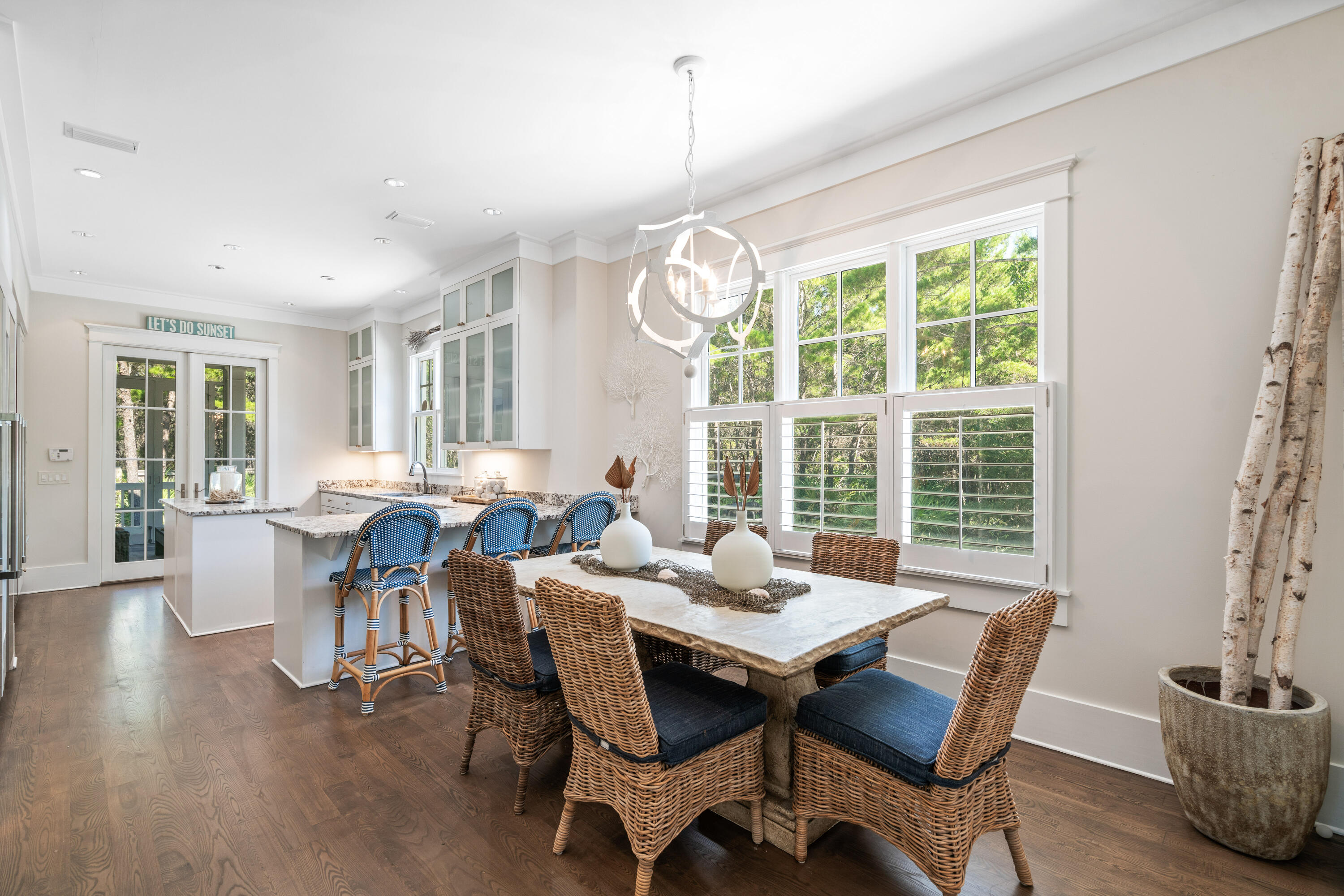 10 Coopersmith Lane Inlet Beach, FL 32461 - Photo 15 of 69 a dining room with furniture a chandelier and wooden floor