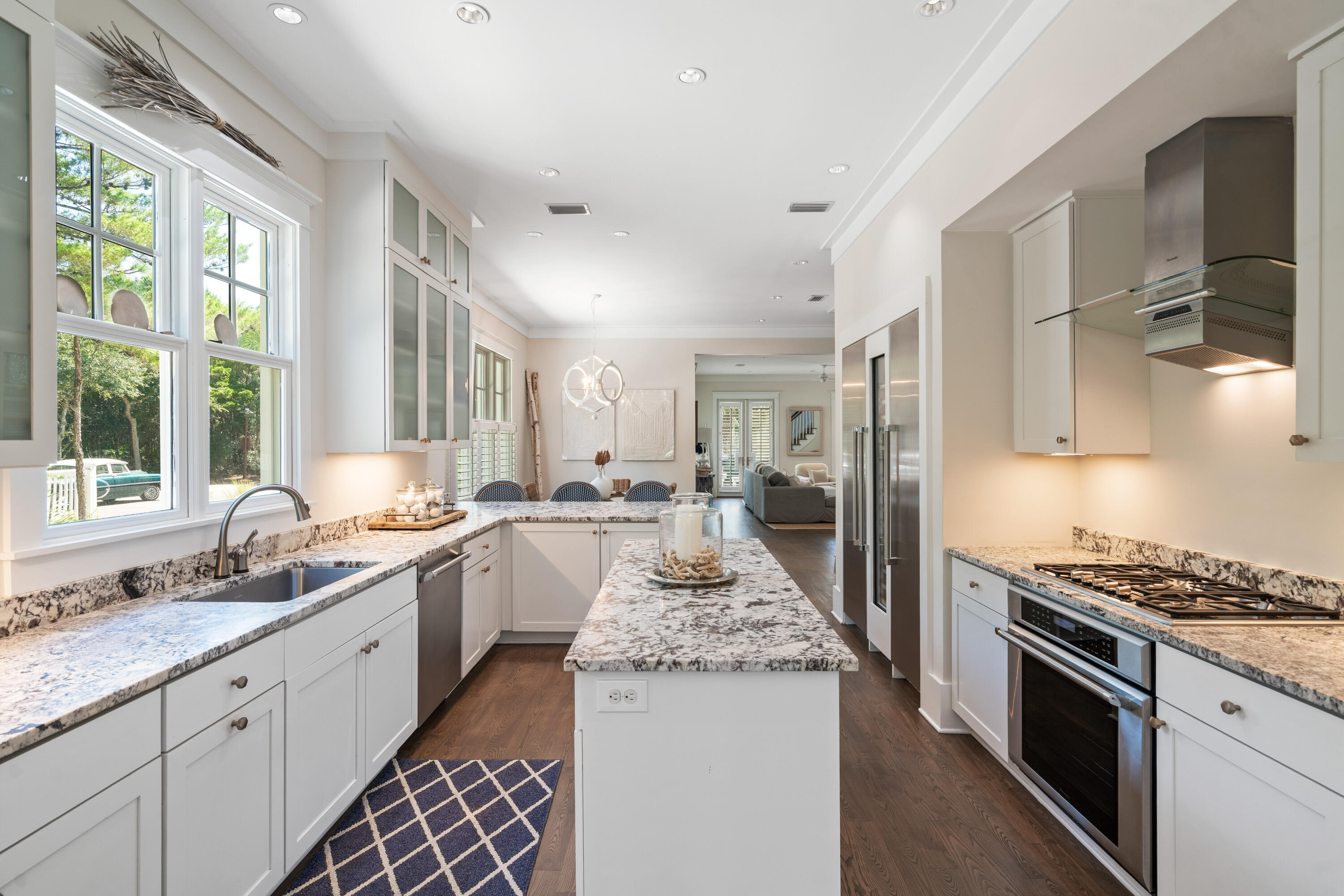 10 Coopersmith Lane Inlet Beach, FL 32461 - Photo 23 of 69 a kitchen with granite countertop stainless steel appliances a sink stove and cabinets