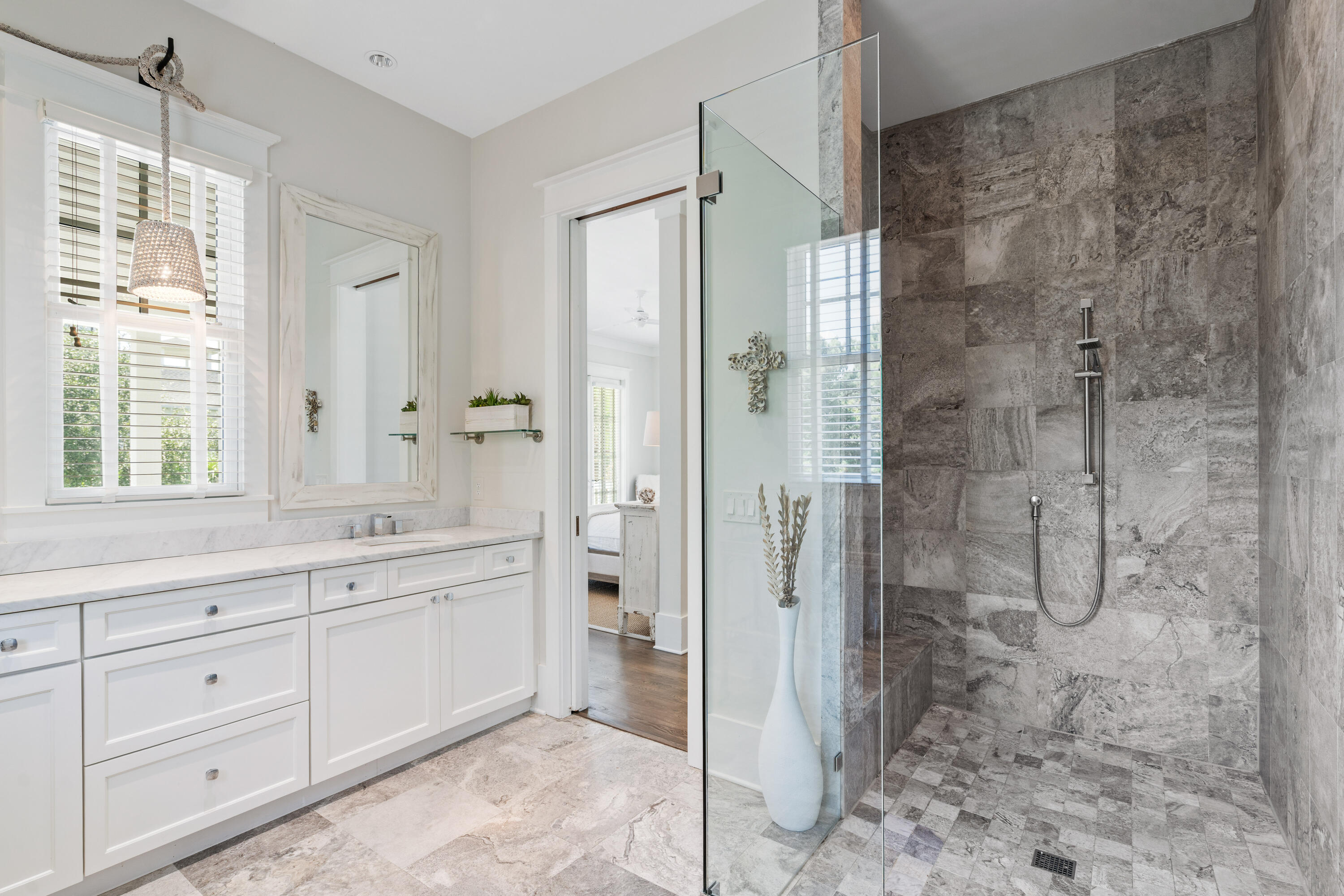 10 Coopersmith Lane Inlet Beach, FL 32461 - Photo 41 of 69 a spacious bathroom with a shower sink and mirror