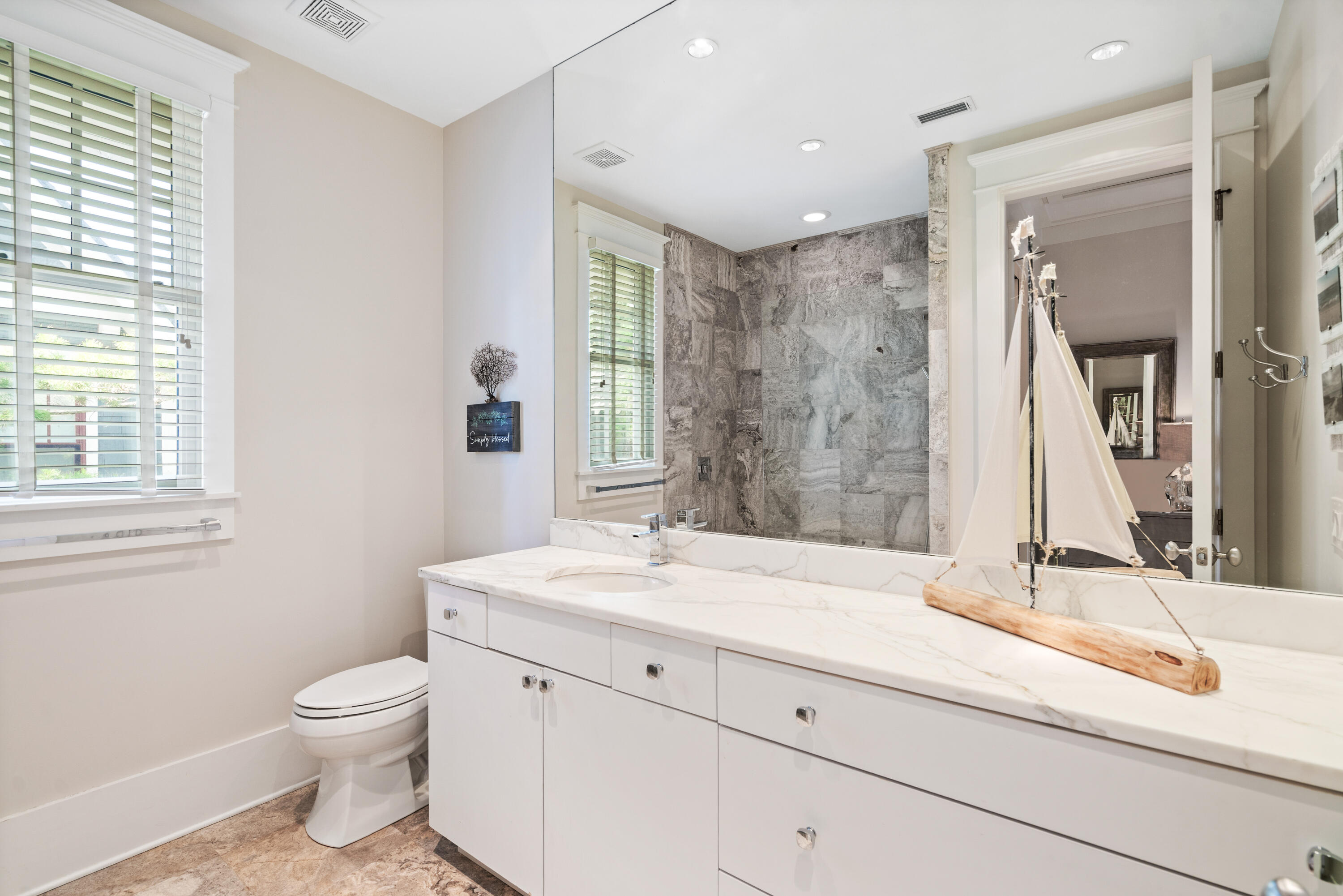 10 Coopersmith Lane Inlet Beach, FL 32461 - Photo 46 of 69 a bathroom with a granite countertop sink a toilet and a mirror