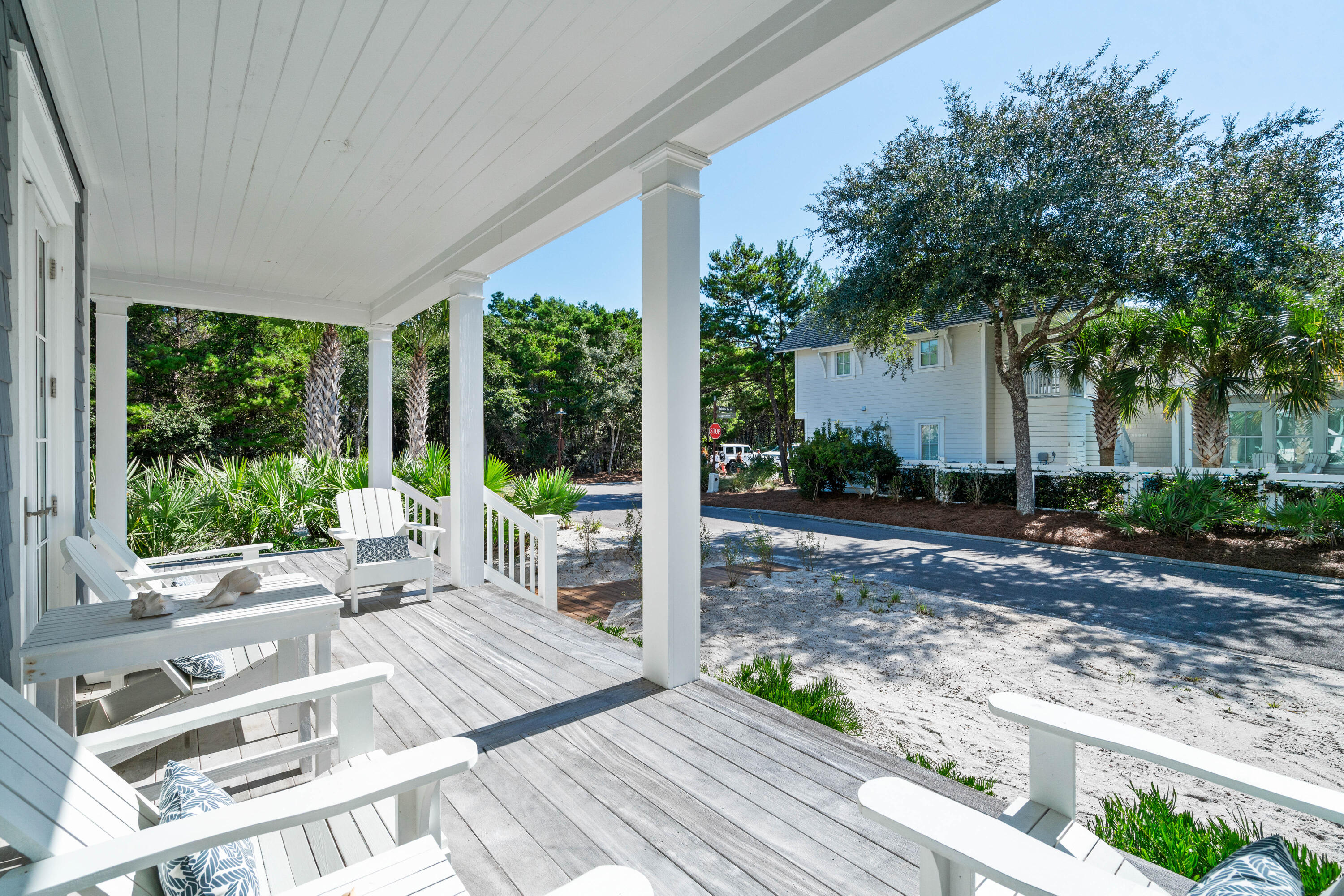 10 Coopersmith Lane Inlet Beach, FL 32461 - Photo 6 of 69 a view of a patio with table and chairs potted plants and floor to ceiling window