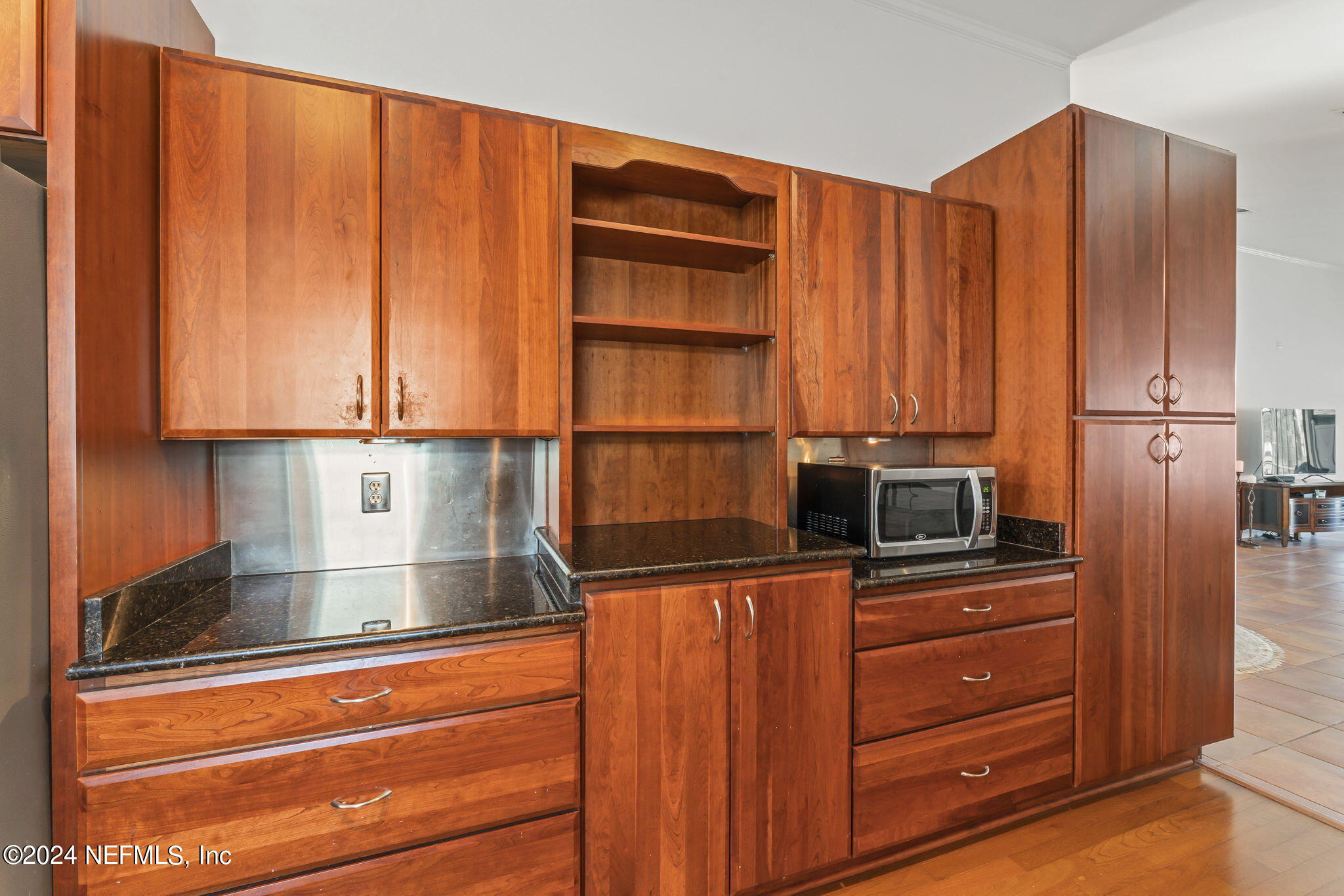 256 Patrick Mill Circle Ponte Vedra Beach, FL 32082 - Photo 16 of 69 a kitchen with stainless steel appliances wooden cabinets and a stove top oven