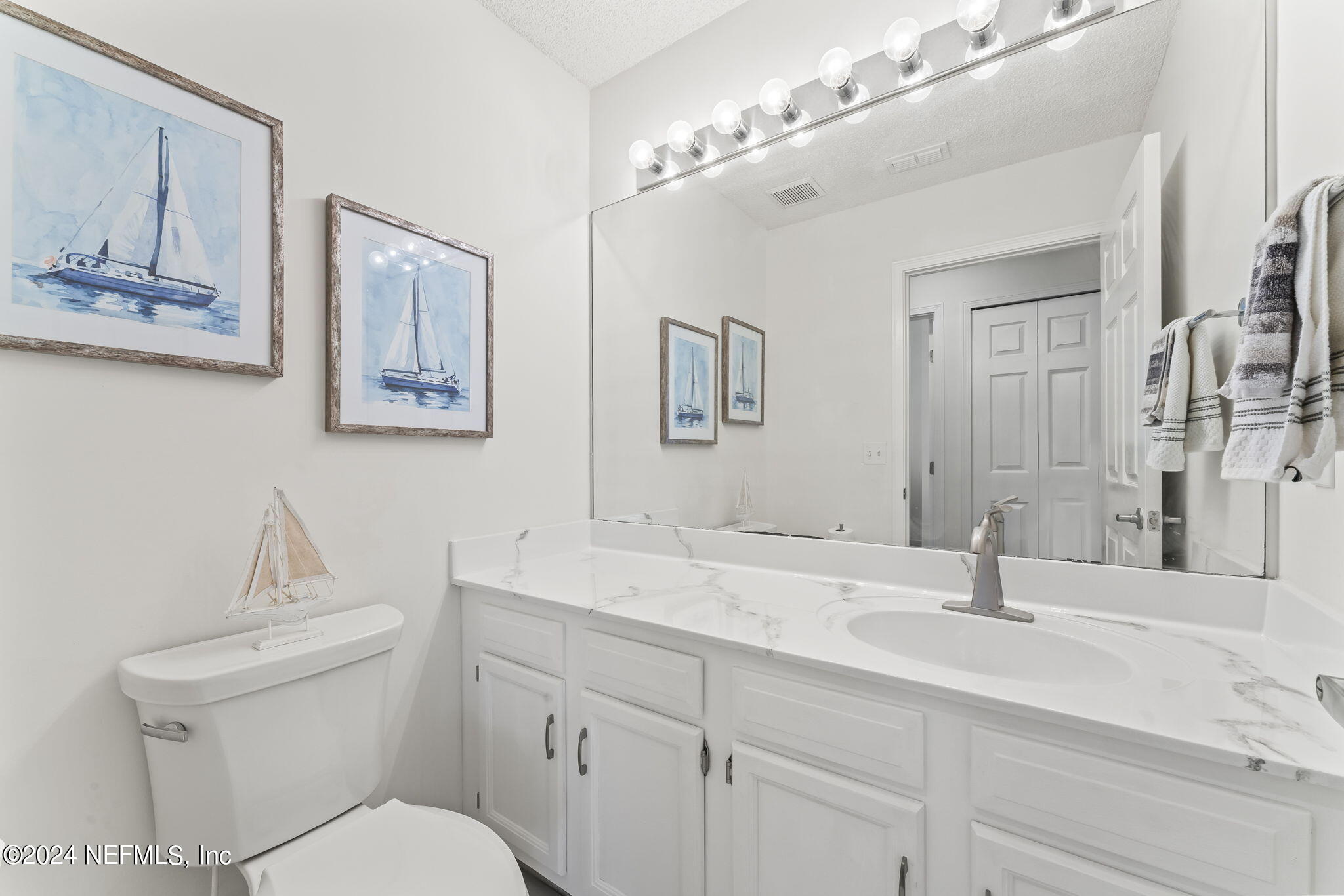 256 Patrick Mill Circle Ponte Vedra Beach, FL 32082 - Photo 22 of 69 a bathroom with double sink and a toilet