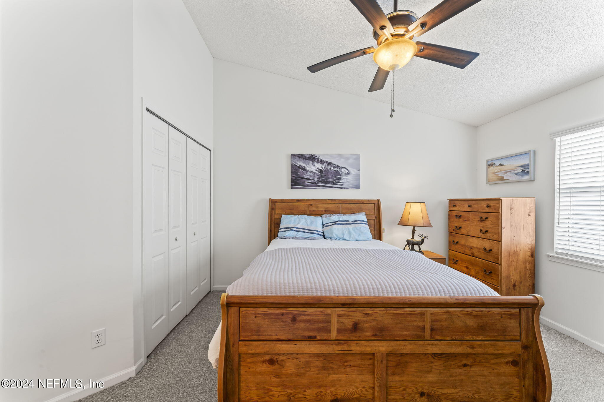 256 Patrick Mill Circle Ponte Vedra Beach, FL 32082 - Photo 24 of 69 a bedroom with a bed and a chandelier