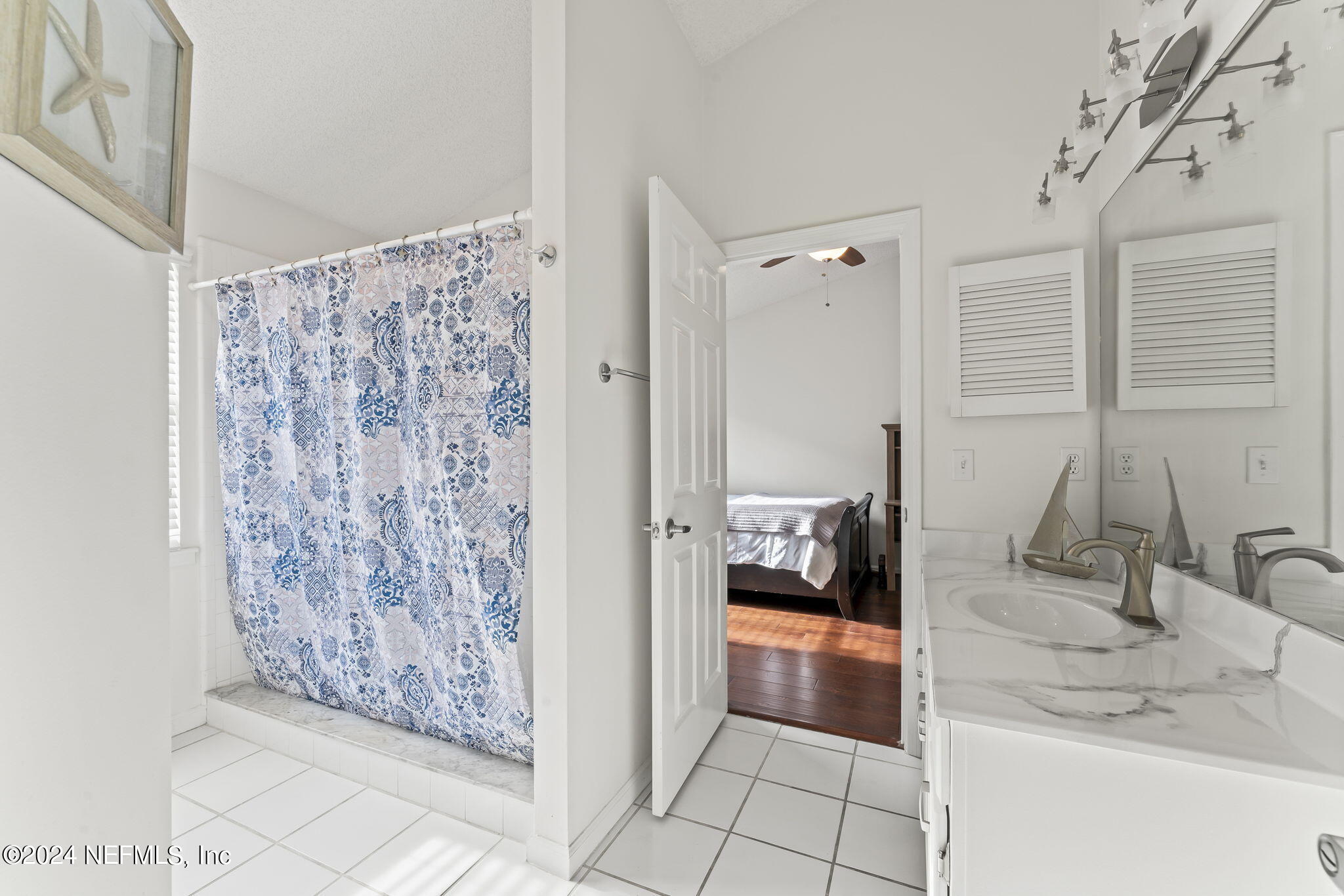 256 Patrick Mill Circle Ponte Vedra Beach, FL 32082 - Photo 25 of 69 a bathroom with a sink and a mirror