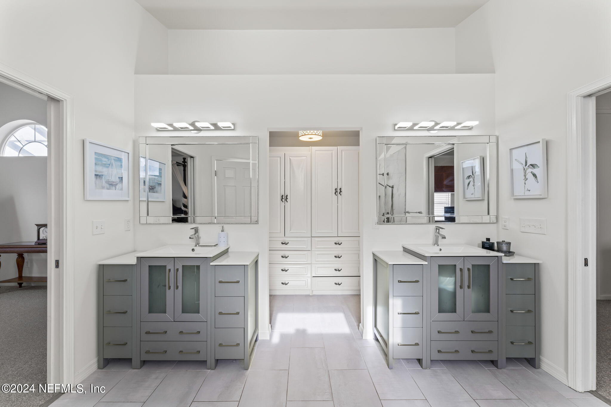 256 Patrick Mill Circle Ponte Vedra Beach, FL 32082 - Photo 34 of 69 a spacious bathroom with a double vanity sink a mirror and a bathtub