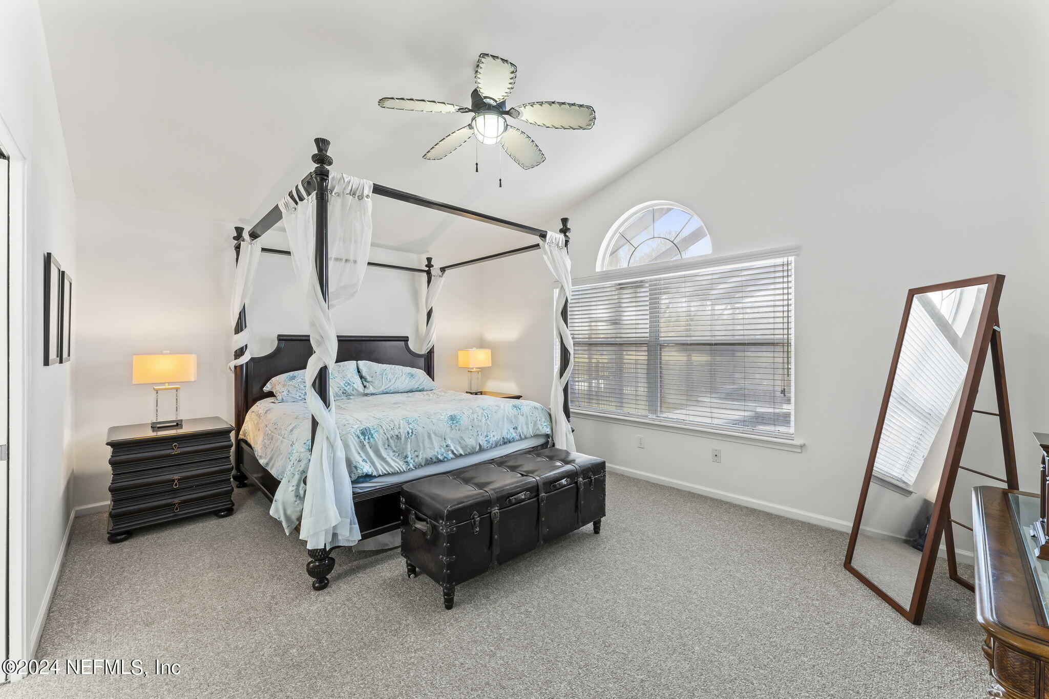 256 Patrick Mill Circle Ponte Vedra Beach, FL 32082 - Photo 37 of 69 a bedroom with a bed a chandelier and a chandelier