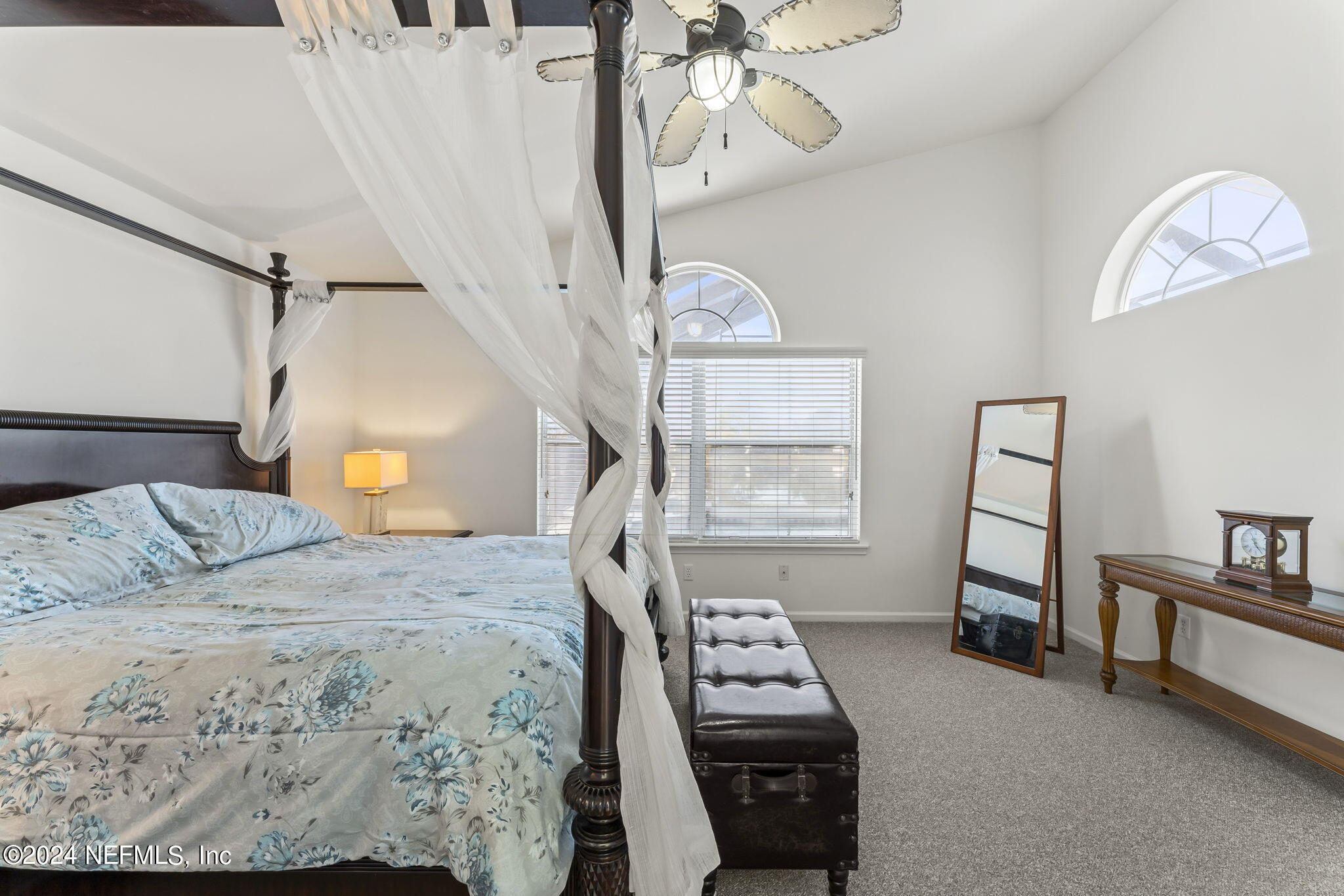 256 Patrick Mill Circle Ponte Vedra Beach, FL 32082 - Photo 39 of 69 a bedroom with a bed and a tv on the dresser