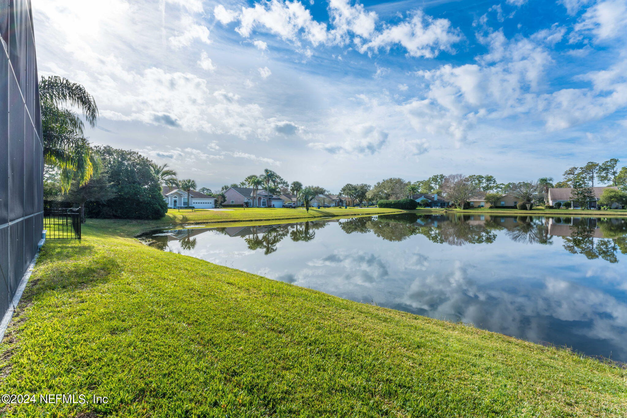 256 Patrick Mill Circle Ponte Vedra Beach, FL 32082 - Photo 49 of 69 a view of a lake with houses in the back