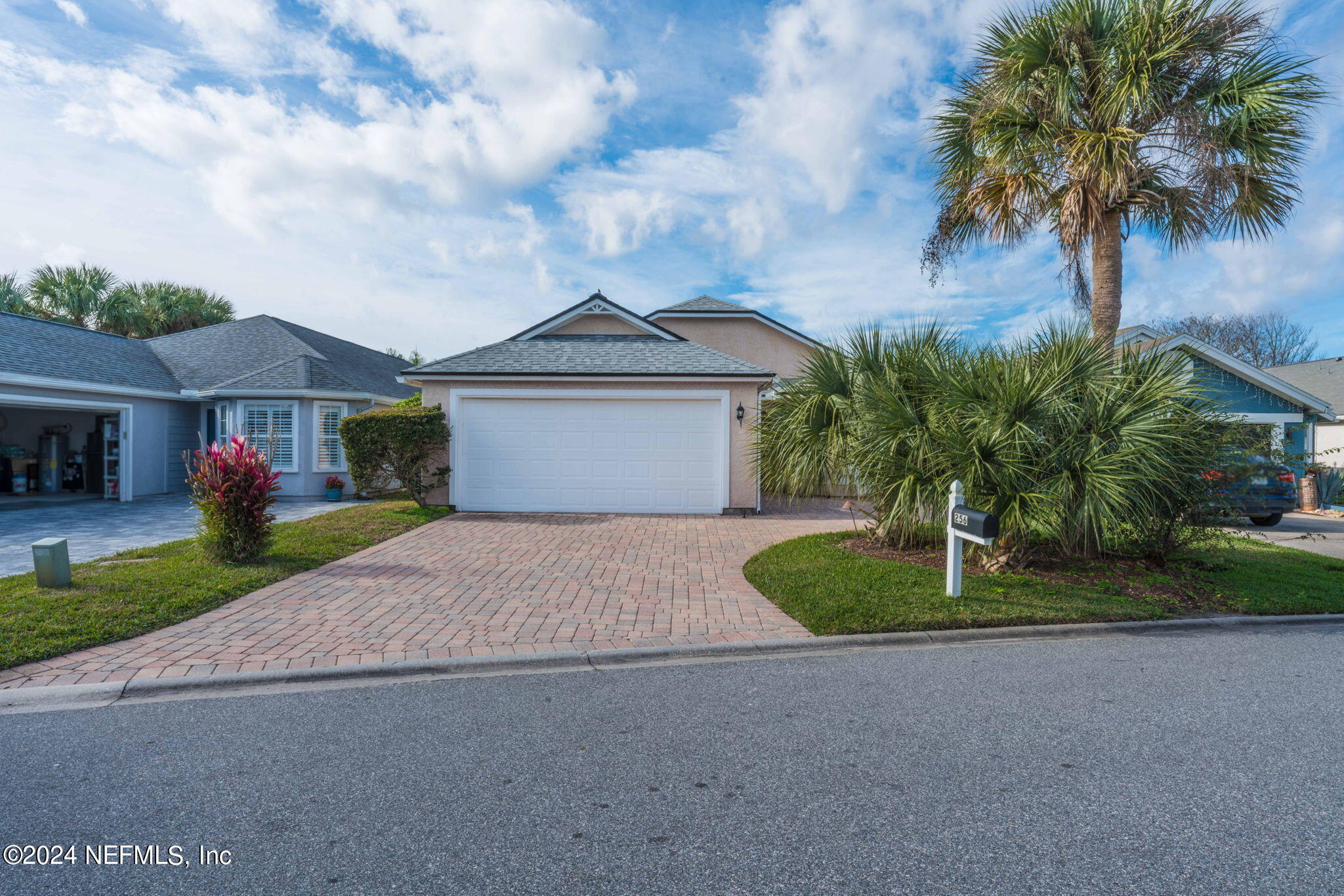 256 Patrick Mill Circle Ponte Vedra Beach, FL 32082 - Photo 52 of 69 a front view of a house with a yard and garage