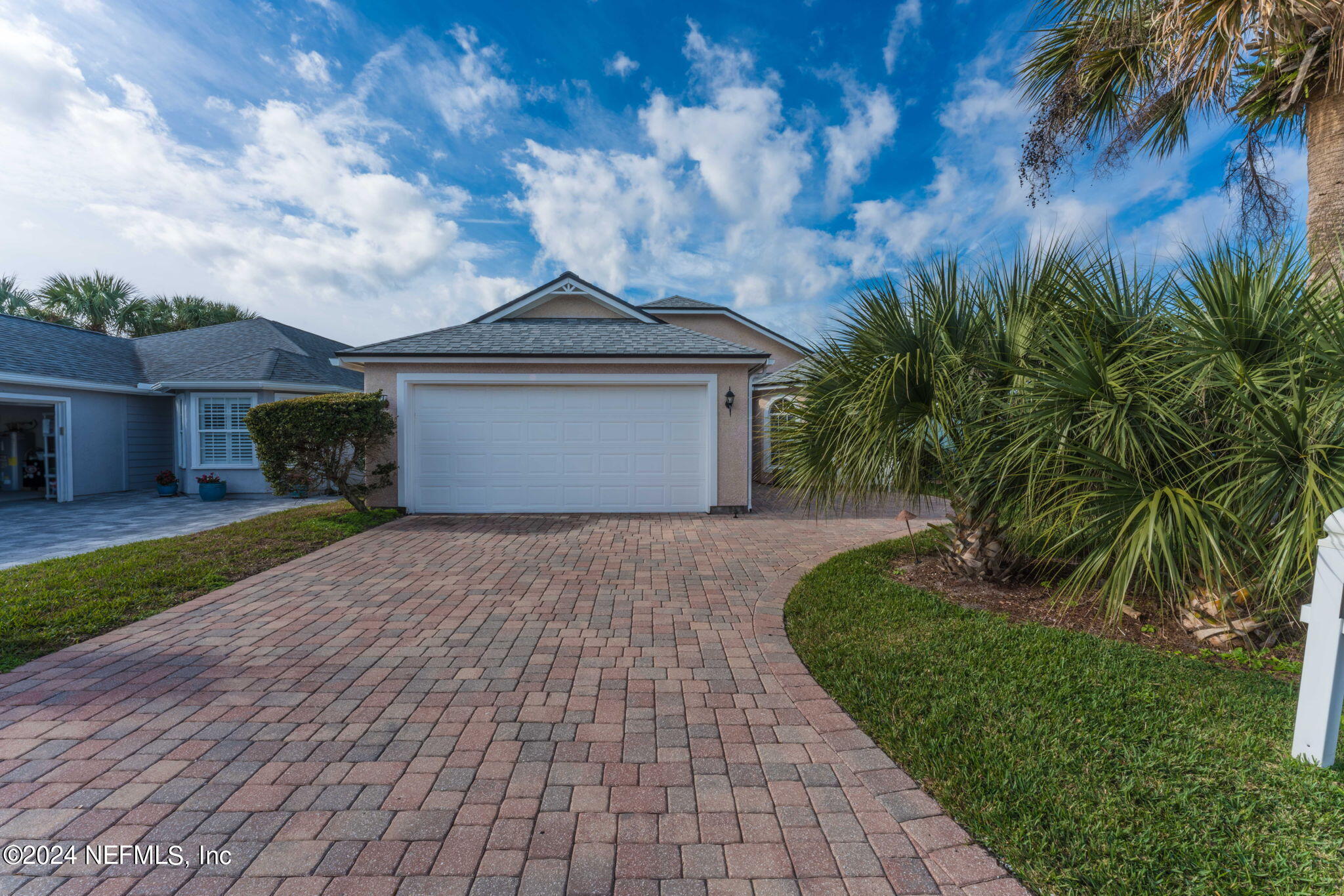 256 Patrick Mill Circle Ponte Vedra Beach, FL 32082 - Photo 53 of 69 a front view of a house with a garden