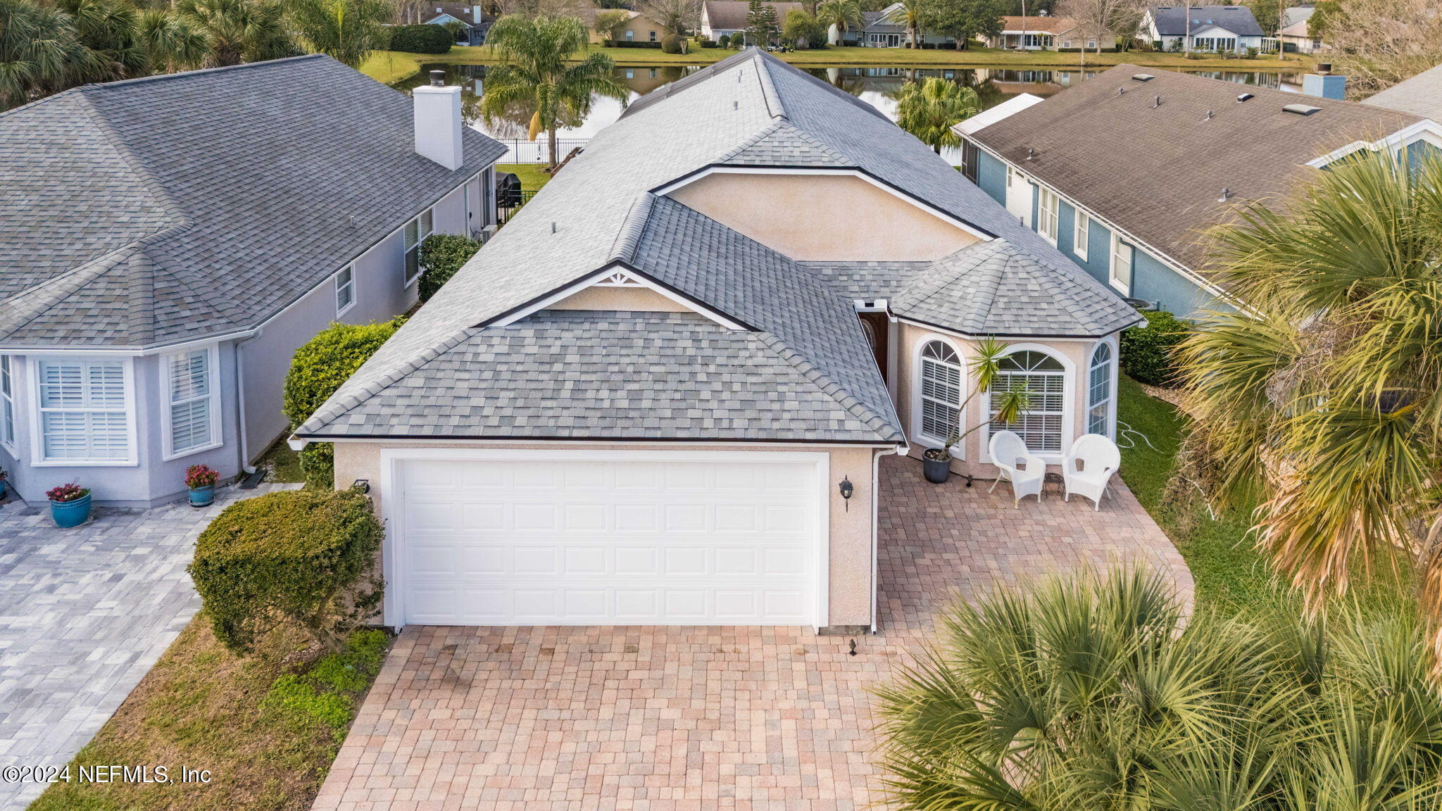 256 Patrick Mill Circle Ponte Vedra Beach, FL 32082 - Photo 57 of 69 an aerial view of a house with swimming pool and large trees