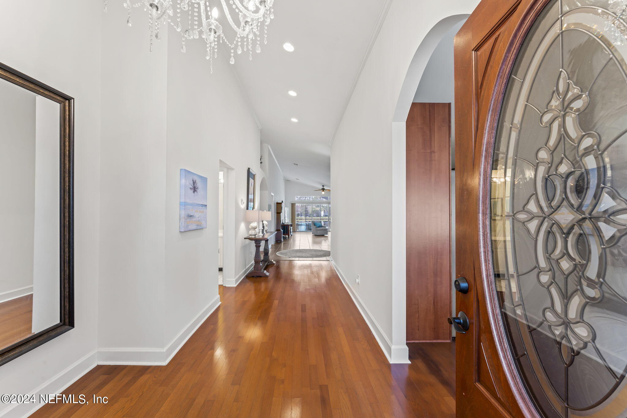 256 Patrick Mill Circle Ponte Vedra Beach, FL 32082 - Photo 6 of 69 a view of a hallway with wooden floor and staircase