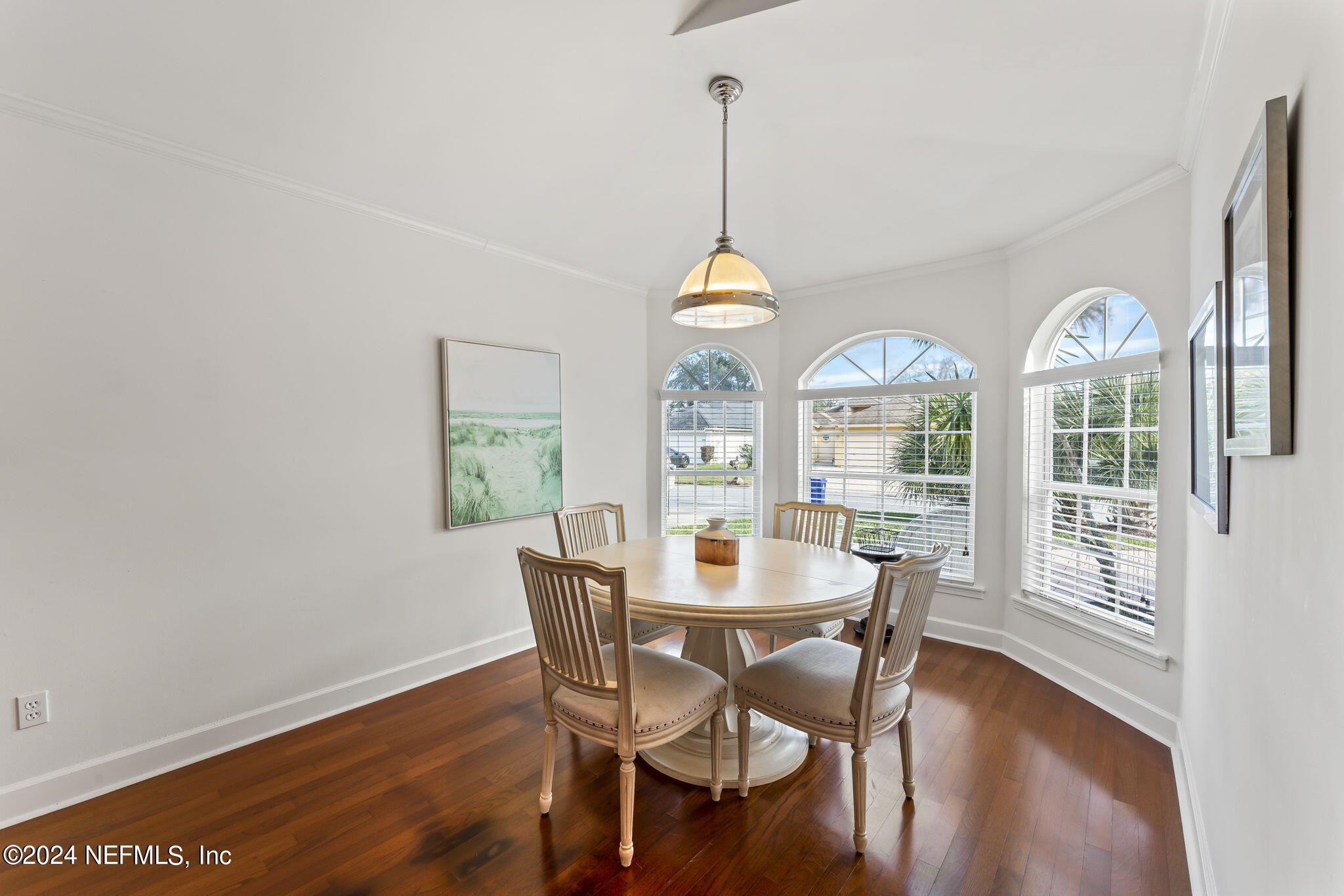 256 Patrick Mill Circle Ponte Vedra Beach, FL 32082 - Photo 10 of 69 a view of a dining room with furniture window and wooden floor