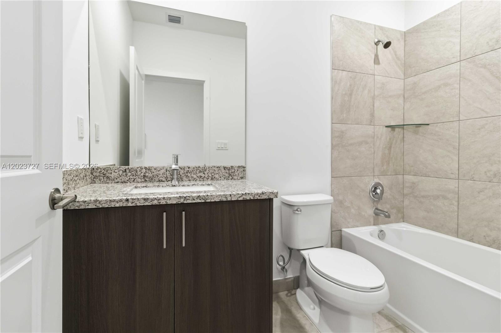 22348 Southwest 115th Court, Unit 22348 Miami, FL 33170 - Photo 17 of 37 a bathroom with a sink and a toilet
