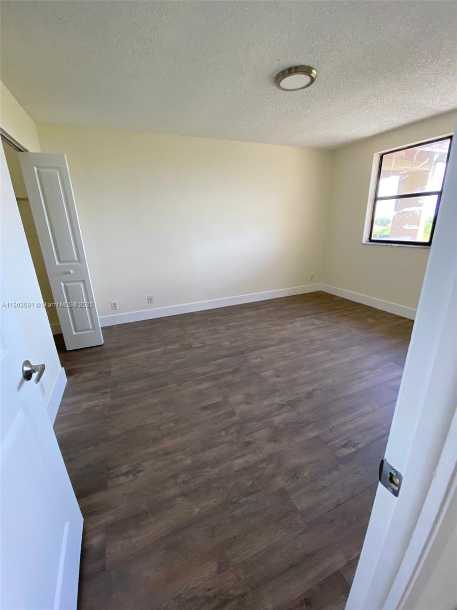 8120 Geneva Court, Unit 554 Doral, FL 33166 - Photo 11 of 32 a view of an empty room and window