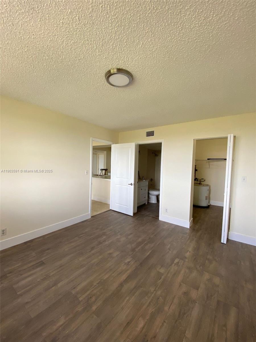 8120 Geneva Court, Unit 554 Doral, FL 33166 - Photo 12 of 32 wooden floor in an empty room