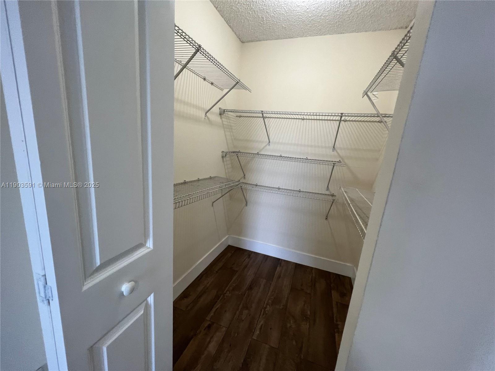 8120 Geneva Court, Unit 554 Doral, FL 33166 - Photo 24 of 32 a view of a walk in closet