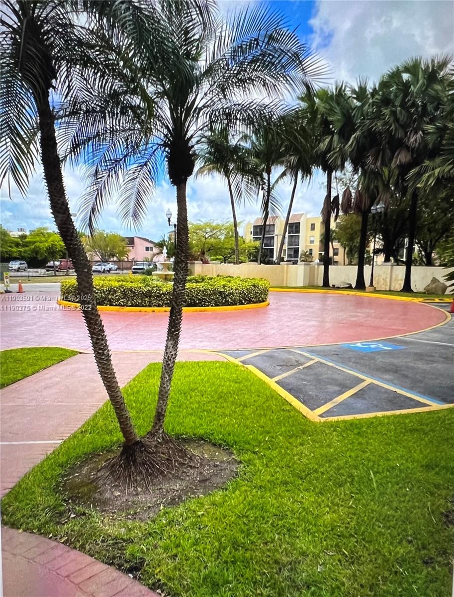 8120 Geneva Court, Unit 554 Doral, FL 33166 - Photo 4 of 32 a view of a playground with slide