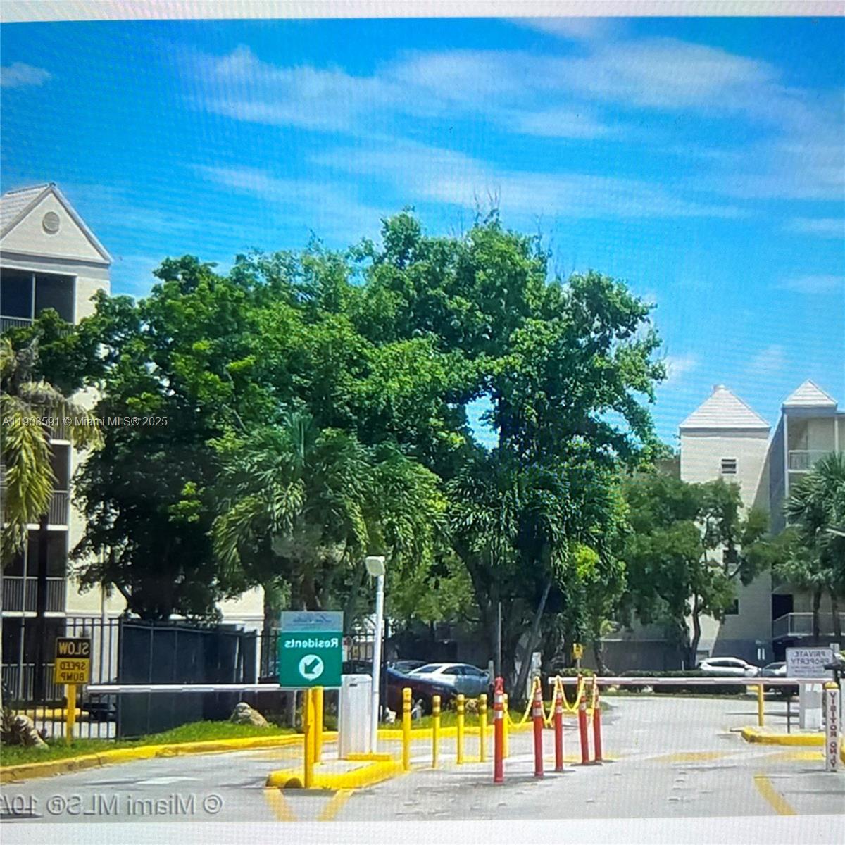 8120 Geneva Court, Unit 554 Doral, FL 33166 - Photo 5 of 32 a view of a swimming pool with an outdoor seating and a garden