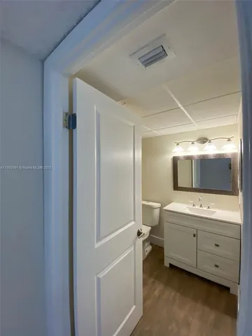 a bathroom with a double vanity sink and mirror